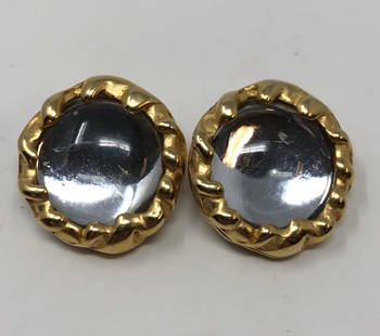 Vintage DKNY Clip on Earrings: Description: Splendid vintage DYNY clip on Earrings, set with large clear stone in a gold tone surround. Stamped on reverse side. Circa 1980s. Material: stone; metal. Measurement: approximate 1"