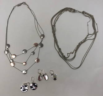 Spectacular Layering Necklace and Earrings Set: Description: Simply wonderful set of 2 multi-strand necklaces to layer, complimented with 5 pierced matching earrings; perfect for to add a little pizzazz to any outfit. All in silver tone metal;