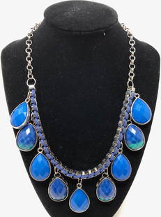 Lovely Vintage Macy: Description: Lovely silver and blues adorn this nice vintage necklace from the venerable Macy's department store (labels still attached!). Nine dangling blue faceted teardrop shaped pendants are suspe