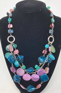 Vintage Twilight Necklace: Description: Gorgeous vintage multi layer necklace in the colors of twilight, from purple to deep blue. Molded, carved plastic beads and dangling discs are suspended from a silver tone metal link