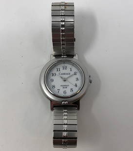 Vintage Ladies Carriage by Timex Indiglo Watch: Description: Vintage Ladies Carriage by Timex Indiglo Watch. Water resistant; silver tone metal with round white face. Material: metal; glass. Measurement: approximate size 7. Shipping: $15;