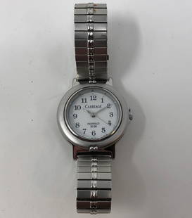 Vintage Ladies Carriage by Timex Indiglo Watch: Description: Vintage Ladies Carriage by Timex Indiglo Watch. Water resistant; silver tone metal with round white face. Material: metal; glass. Measurement: approximate size 7. Shipping: $15; different