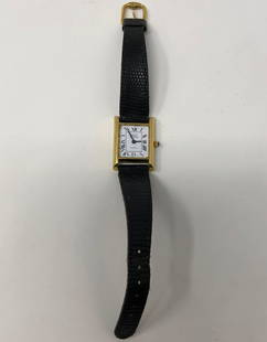 Vintage Brook Brothers Ladies Watch: Description: Vintage Brook Brothers Ladies Watch with black leather strap. Attractive rectangular-shaped white face accented with gold tone metal. Material: metal; glass; leather. Measurement: