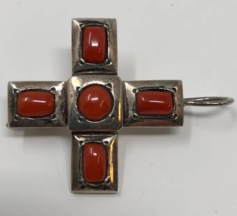 Sterling and Carnelian Cross-Shaped Pin: Description: Striking sterling silver and orange carnelian cross-shaped pin. Pin is set with 5 splendid carnelians, which also serve as the birthstone for the month of August. Stamped on underside.