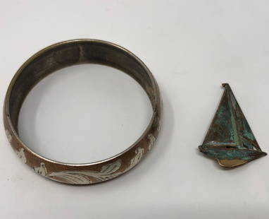 Engraved Bangle and Verdigris Sailboat Pin: Description: Pretty pairing of a copper-washed, floral engraved bangle with a verdigris sailboat pin. Material: metal. Measurement: approximate size 8 bangle/pin 2" (INCHES). Shipping: $12; different