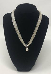 Vintage Silver tone and Pearl Torsade Necklace: Description: Vintage torsade multi=strand necklace with lovely glass pearl suspended from center. Choker length. Material: Metal; glass. Measurement: approximate 15" unclasped. Shipping cost: $12.