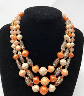 Delicious Vintage Tangerine and Gold Beaded Torsade: Description: Delicious, vintage tangerine colored beaded torsade; strung on metal chain, some beads accented with a gold tone metal wash. Shades range from a summer color palette of off white, pale pi