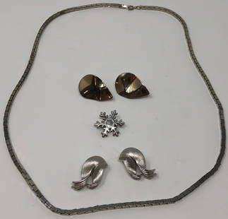 Silver Tone Collection: Description: Splendid set of silver tone metal vintage jewelry including a link necklace, 2 pairs of non pierced earrings and one snowflake pin with white enamel. Material: metal; enamel.