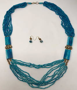 Aegean Blue Vintage Beaded Necklace and Earrings: Description: Absolutely stunning Aegean blue vintage beaded necklace accented with gold tone beads and stone spacers. Longer length can be worn doubled for versatility. We have paired it with a pretty