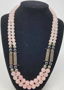 Silver and Rose Quartz Beaded Necklace: Description: Lovely pale pink rose quartz, double strand necklace enhanced with silver spaces and hematite beads. Cool and delicious to the touch; we have paired this necklace with splendid oval rose