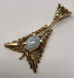 14 karat Gold Pendant w/Opal: Description: Graceful, Eiffel Tower-shaped 14 karat gold pendant with opal and attached bale. Material: 14 karat gold; opal. Measurement: approximate 1" (INCH).Shipping cost: $12