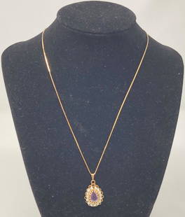 14 Karat Gold Estate Pendant and Necklace: Description: From the estate collection: beautiful vintage 14 karat gold teardrop-shaped pendant, encircled with tiny gray pearls and set with a lovely faceted amethyst in the center. Material: 14