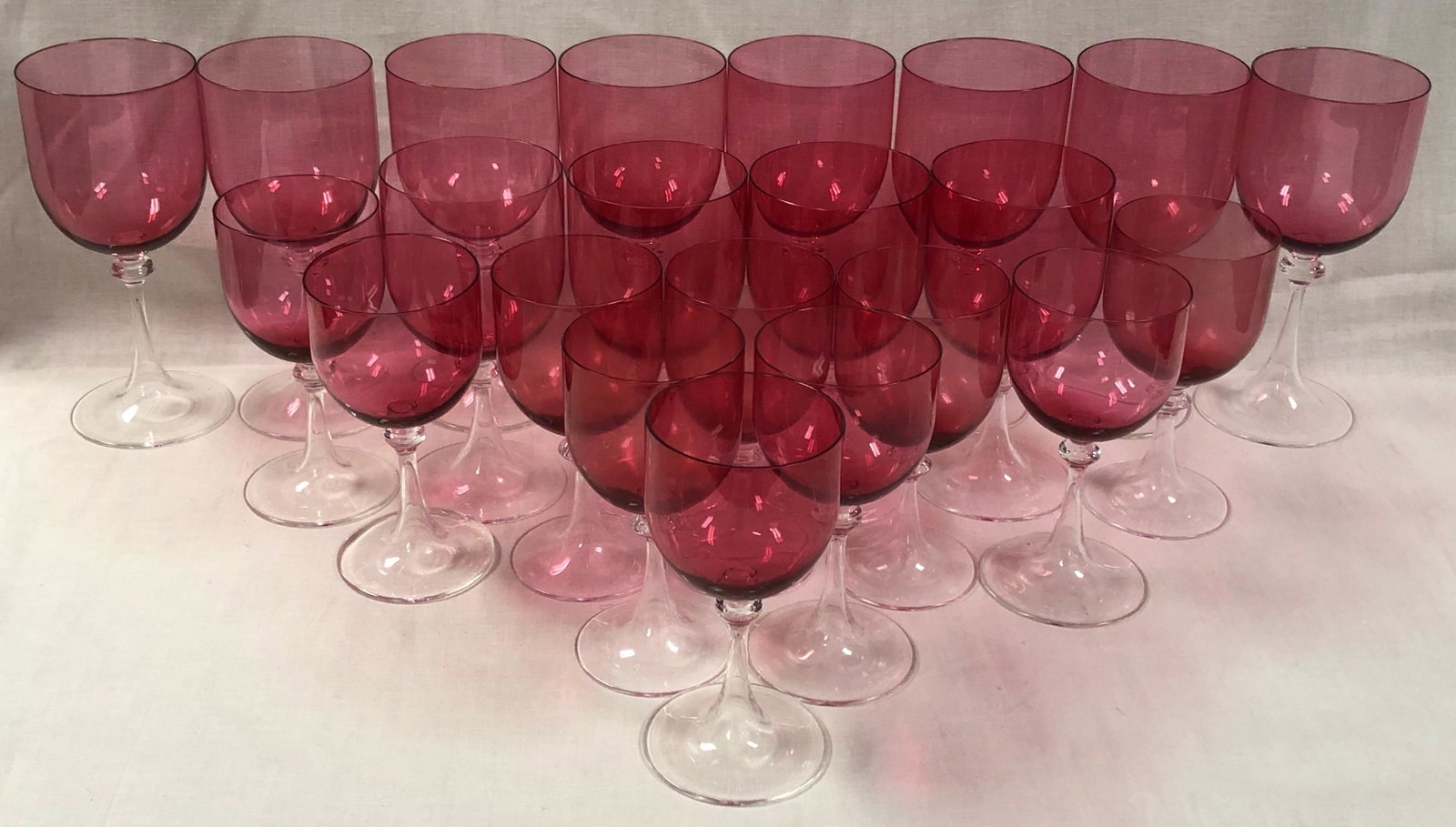 Italian Glass Goblets, Set of 22: Description: Red Italian glass goblet set of of 22. Graceful clear stems topped with light red; very elegant and versatile presentation. Set includes 8 water goblets size; 4 red wine; 8 white wine gob