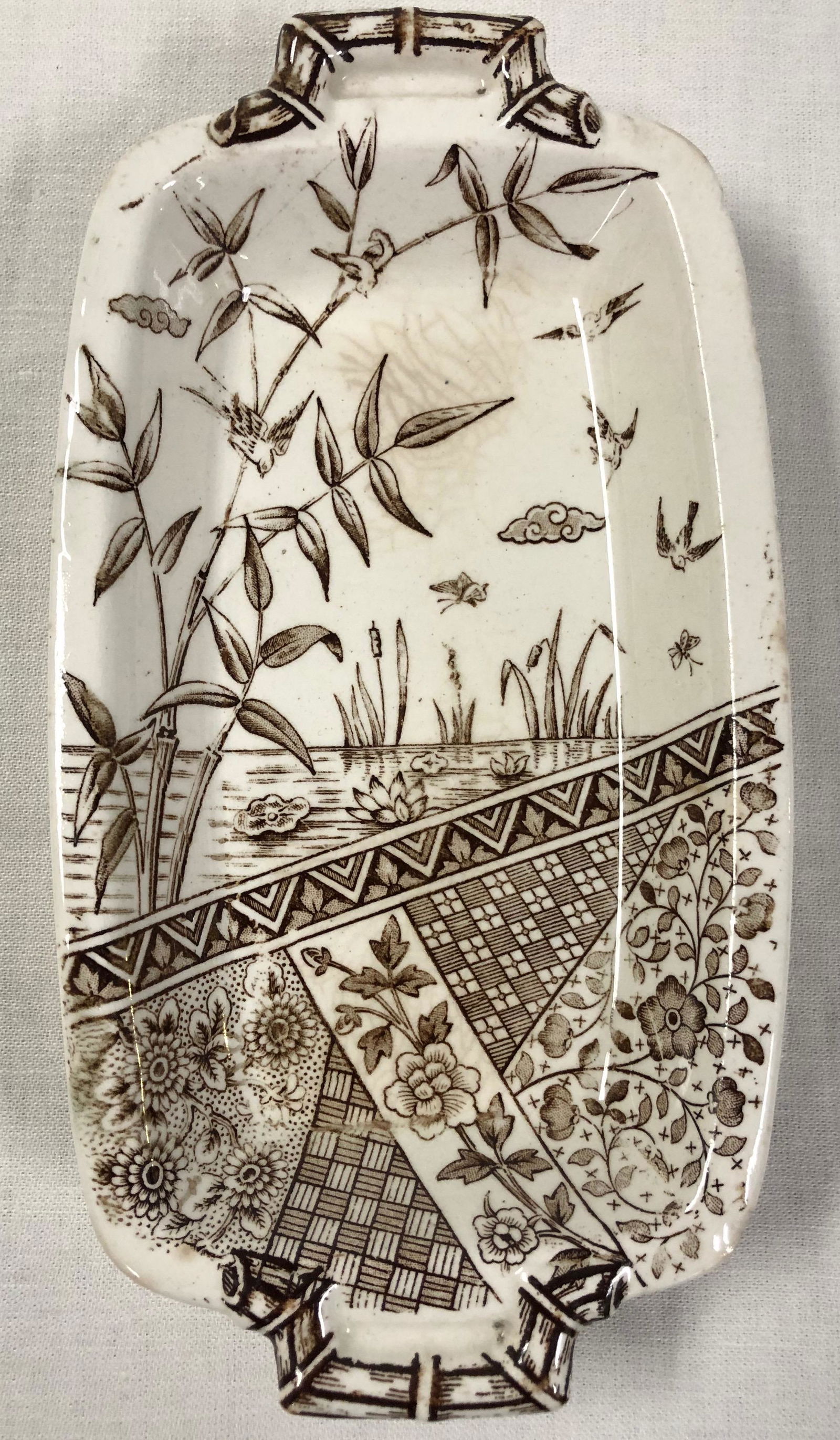 1883 W.H. Grindley & Co Burmah Pattern Butter Dish: Description: 1883 W.H. Grindley & Co Burmah Pattern Butter dish. Striking old piece of porcelain of the Aesthetic Movement; featuring a lovely design of bamboo, water lilies, cattails and birds in the