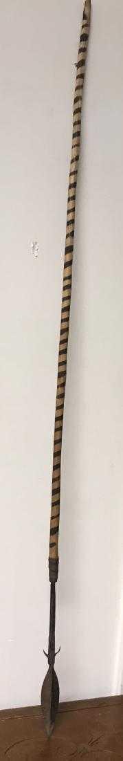Antique East Africa Massai Spear w/ Striped Wood: Description: Antique East Africa Massai spear with striped wood handle. Measurement approximate: 52" h / 11" blade (Inches). Material: metal; wood. Shipping cost: $80, except to California, Alaska & H
