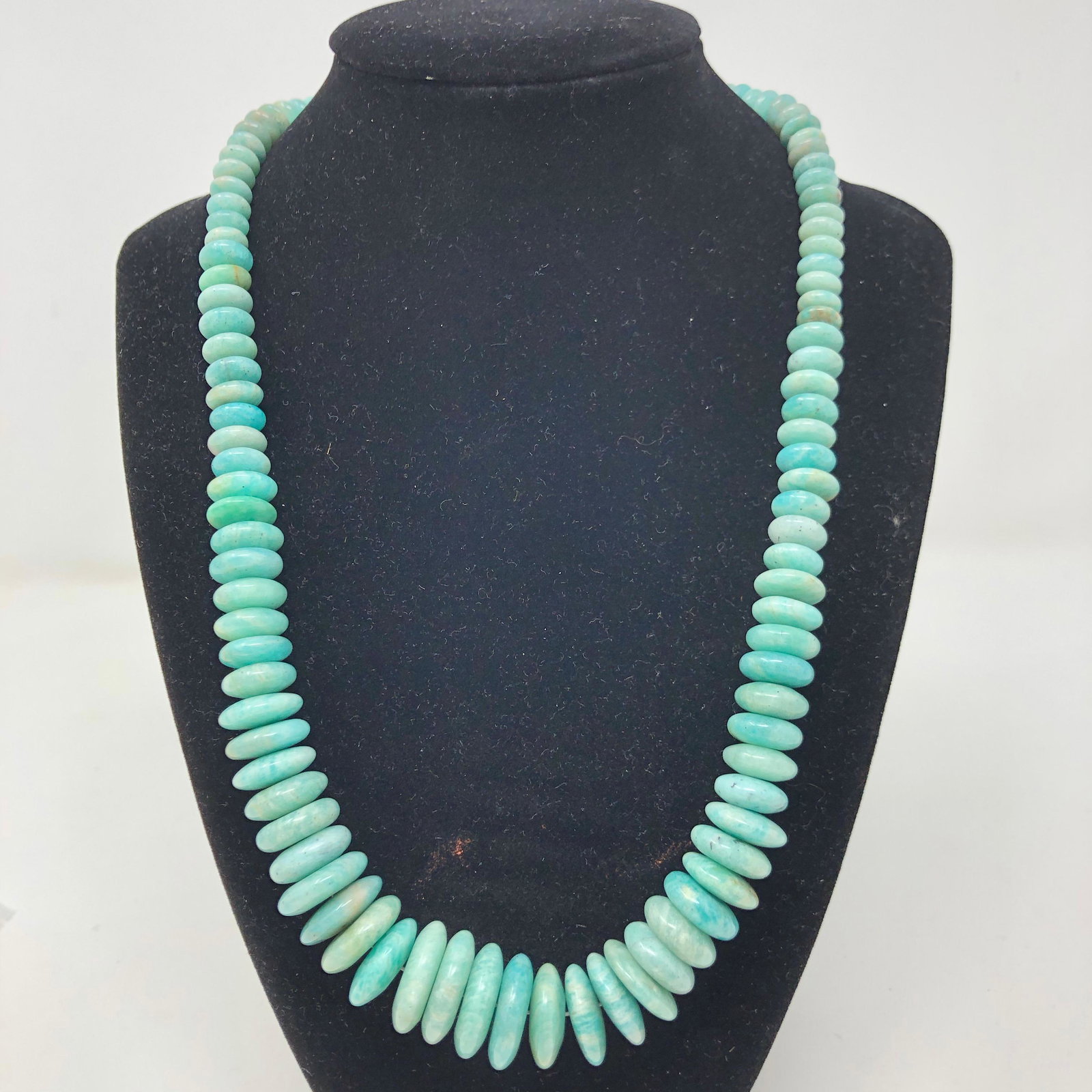 Sea Blue/Green Amazonite and Sterling Necklace: Description: Wonderful necklace of highly polished, soothing blue green Amazonite discs, capped with sterling. Amazonite is a very ancient gemstone thatâ€™s known for its beauty and healing enhan
