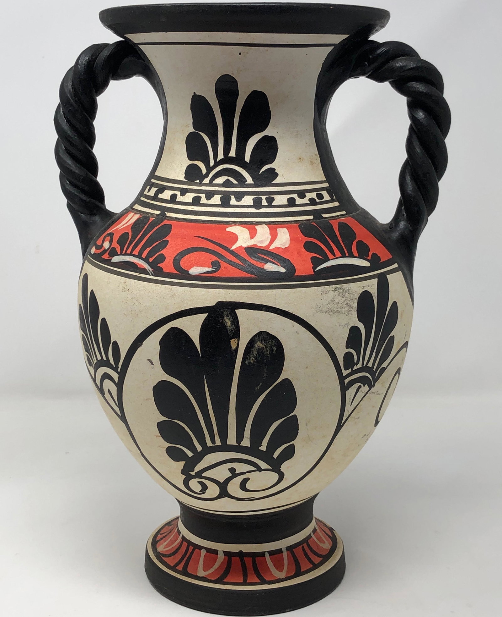 P. Carcaus Greek-Style Amphora Vase: Description: Stately P. Carcaus Greek-Style Amphora Vase, signed on underside. Larger sized, painted in a captivating combination of white, red and black, with scrolled handles. Made in Greece. Materi