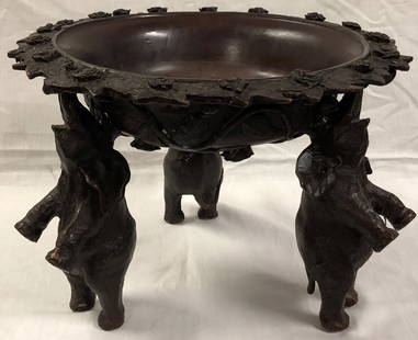 Amazing Antique Bronze Bowl: Description: Fabulous carved bronze bowl supported by the trunks of three standing elephants. This is a robust, heavy weight piece with superior craftsmanship and presence. Material: solid bronze.