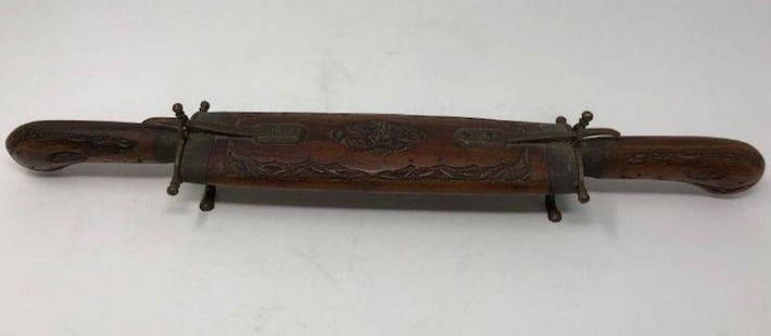 Vintage Indian Carving Set with Wood Case: Description: A unique find! Serving fork and carving knife encased in self-standing wooden holder with metal fittings and supports. Material: metal; brass; wood. Measurement: approximate 18"l