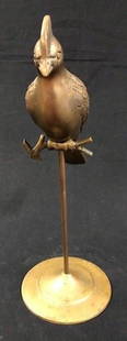Vintage Brass Bird on a Stand: Description: Retro chic vintage brass bird (possibly male love bird) on stand. One piece body, affixed to perch and stand; nicely detailed. Material: brass. Measurement: approximate 14.5"h x 11"w