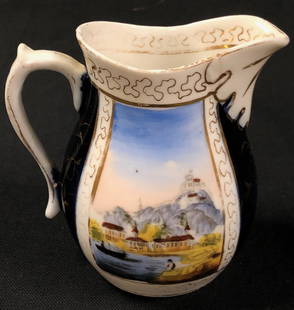 Antique European Porcelain Pitcher: Description: Exquisite antique porcelain pitcher with European provenance, most probably Netherlands or German. Beautiful hand painted depicts two panel landscape scenes with Moorish-style