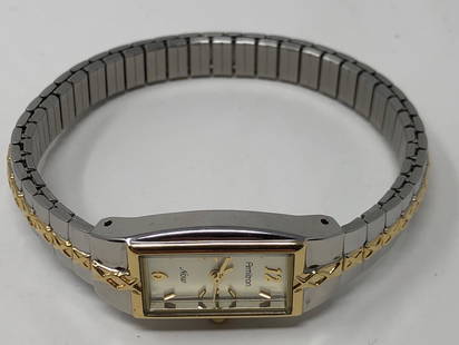 Stylish Armitron Quartz Ladies Watch 25/5448 802.104: Description: Stylish silver and gold tone metal Armitron quartz ladies watch 25/5448 802.104 Thailand Movement, water resistant, stainless steel back. Material: glass; metal. Measurement: approximate