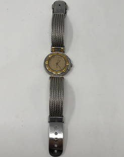 Highly Collectible Phillippe Charriol Ladies Watch: Description: Highly sought after Phillippe Charriol Ladies Watch, two tone metal, round face with day, G 8117. Swiss Quartz, water resistant. Material: metal; glass. Measurement: approximate size