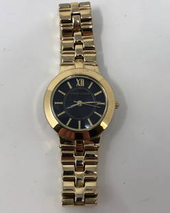 Elegant Anne Klein Ladies Watch: Description: Elegant Anne Klein 1494 Y121E ladies watch, gold tone metal with attractive dark blue face. Water resistant, stainless steel back. Material: metal; glass. Measurement: approximate size