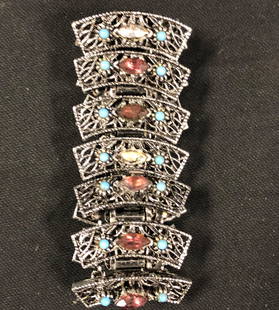 Vintage Marcasite-Style Link Bracelet: Description: Great retro marcasite style link bracelet enhanced with turquoise-colored beading and glass crystals in center. Bold yet elegant. Material: metal; plastic; glass. Measurement: approximate