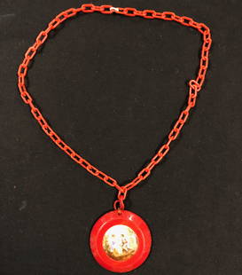 Vintage Bakelite Pendant w/Painted Ceramic Center: Description: Unusual vintage Bakelite chain and pendant set with painted ceramic center, depicting a romantic couple. Ceramic is set in red, round Bakelite pendant, suspended from a red, chain link