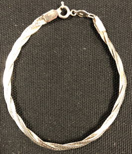 Stunning Sterling Silver Braided Snake Bracelet: Description: Stunning Sterling Silver braided snake link bracelet. Material: Sterling silver. Measurement approximate 7". Shipping: $12.00 within the United States only.