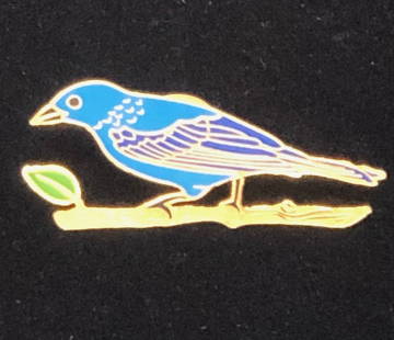 La Libertad Enamel Bird Pin: Description: In original box with paperwork and price tag from retailer--La Libertad Enamel Bird Pin. La Libertad was created as a brand in 2009, a product of the imagination and initiative of