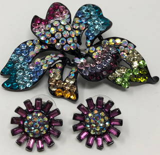 Shimmering Austrian Crystal Pin and Pierced Earrings: Description: Shimmering vintage crystal brooch and pierced floral-style earrings in a lovely array of colors. Brooch inscribed with Austria on reverse side. Material: glass; metal. Measurement: