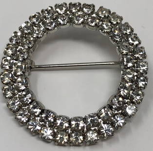 Elegant Round Ladies Brooch: Description: Elegant Round Ladies Brooch, always in fashion. Circular-shaped brooch, set with clear crystals. Material: metal; glass. Measurement: approximate 1.25" (INCHES). Shipping: $10; different