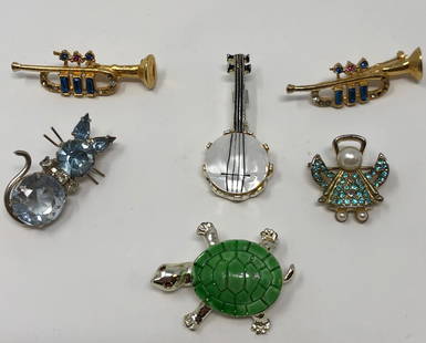 Set of 6 Ladies Brooches: Description: Eclectic set of six vintage ladies brooches, crafted in metal and adorned with enamel and crystal. Sizes and themes vary, including a very lovely angel, a pretty kitty set with blue