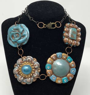 Vintage Handmade Same Spirit Clay Necklace: Description: Wild and wonderful vintage Same Spirit bronze and turquoise-colored clay necklace, handmade in Texas and adorned with rhinestones. Suspended on a metal open link chain; stamped with mark
