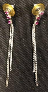 Feminine Silver Dangle Pierced Earrings Set with Pink: Description: Very pretty silver chain pierced earrings, decorated with 3 pink crystals. Plastic backing. Material: metal; crystal. Measurement: 2"L (INCHES). Shipping cost: $10. International rate