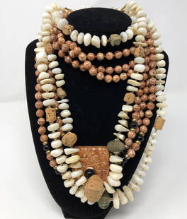 Vintage Tribal-Style Necklaces: Description: Dramatic pair of high quality, vintage tribal-style necklaces in cream and tan natural stone. Three strand natural stone necklace in a creamy, off-white is accented with natural and