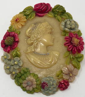 Wonderful Vintage/Antique Celluloid Cameo Brooch: Description: Wonderful vintage/antique hand painted celluloid cameo ladies brooch. The portrait is depicted from the traditional side view amid the oval is wreathed in sweetly hand painted flowers.