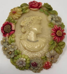 Wonderful Vintage/Antique Celluloid Cameo Brooch: Description: Wonderful vintage/antique hand painted celluloid cameo ladies brooch. The charming portrait is depicted from the traditional side view amid the oval is wreathed in hand painted flowers.