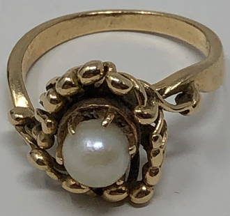 14 Karat Peal Ring: Description: Simple and elegant, this attractive estate piece features a pearl set in a 14 karat gold ring. Material: 14 karat gold; pearl. Measurement: approximate ladies size 7. Shipping: $12;