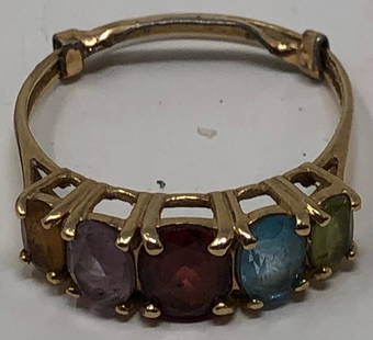 Sparkling 10 Karat and Semi Precious Ring: Description: Fabulous estate ring of 10 karat gold, set with 5 semi precious stones: topaz; amethyst, garnet, aquamarine, and peridot. Ring comes with guard to adjust size, may be removed. Material: