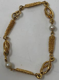 Gorgeous Faux Gold and Pearl Vintage Bracelet: Description: Vintage faux gold bracelet set with pearls. Material: metal. Measurement: approximate 7" (INCHES). Shipping: $12; different rate to Alaska, California, Hawaii and all International.