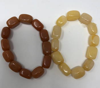 Beautiful Natural Stone Bracelet Pair: Description: Gorgeous pair of natural stone bracelets in cool colors of palest orange and cream tinged with pale orange. Hand crafted with highly polished natural stones. Stretch style. Material: