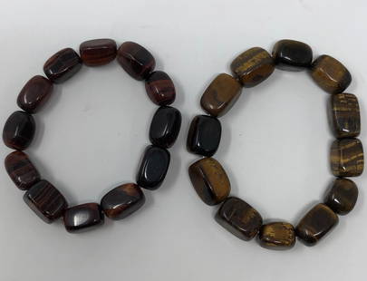 Beautiful Natural Stone Bracelet Pair: Description: Intriguing pair of natural stone bracelets in elegant tiger eye. Stretch style with beautiful color variations against brown and purple backgrounds. Hand crafted of highly polished natura