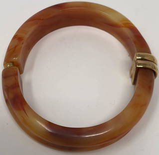 Vintage Avon Plastic Peach & Marbled Amber Hinged: Description: Avon Calling! Great vintage Avon plastic peach & marbled amber hinged bangle ladies bracelet. With gold tone hinges and lightly carved exterior; hallmarked on interior of hinge.Shipping