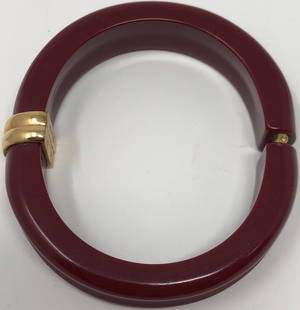 Vintage Avon Burgundy Plastic Hinged Bangle Bracelet: Description: Avon Calling! (Once again.) Great vintage Avon deep burgundy plastic hinged bangle ladies bracelet. With gold tone hinges and lightly carved exterior; hallmarked on interior of hinge.