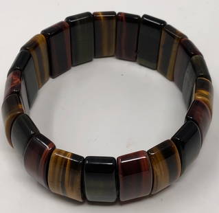 Highly Polished Natural Stone Bracelet: Description: Elegant stretch-style ladies bangle, crafted of smooth, highly polished semi-precious stones. Material: Natural, semi-precious stones. Measurement: approximate ladies size 8. Shipping: