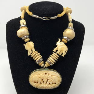 Exquisite Vintage Bone Elephant Necklace: Description: Absolutely exquisite vintage bone necklace, depicting elephants all with raised trunks (for good luck), set in silver (most probably from India). Unique piece features an oblong-shaped