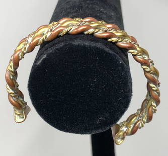 Vintage Mixed Metal Men: Description: Stylish, twisted metal cuff-style vintage bracelet for men with copper and brass. Material: metal. Shipping: $12; different rate to Alaska, California, Hawaii and all International.